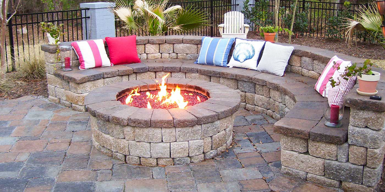 A DIY, masonry brick Natural Gas fire pit with fire glass media built on a masonry brick base
