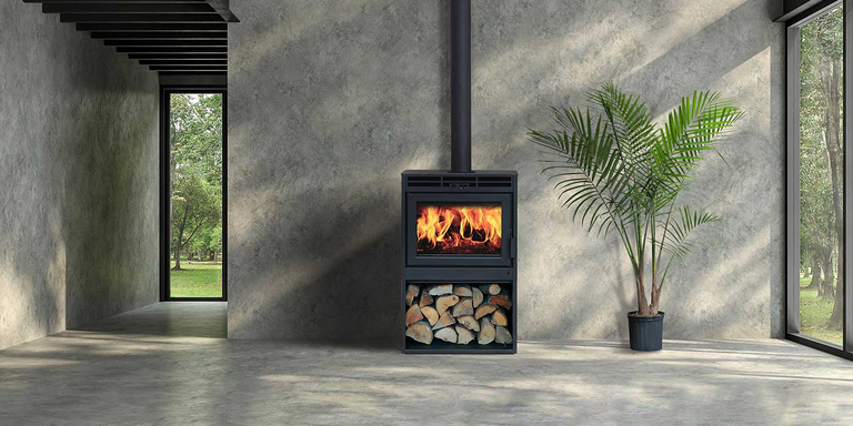 An industrial living space with a wood burning stove 