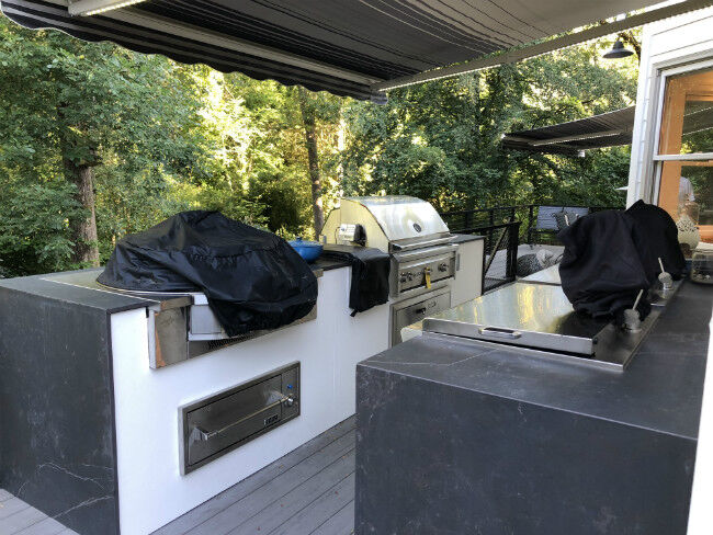 Gray and white outdoor kitchen island with drop-in cooktop and grill