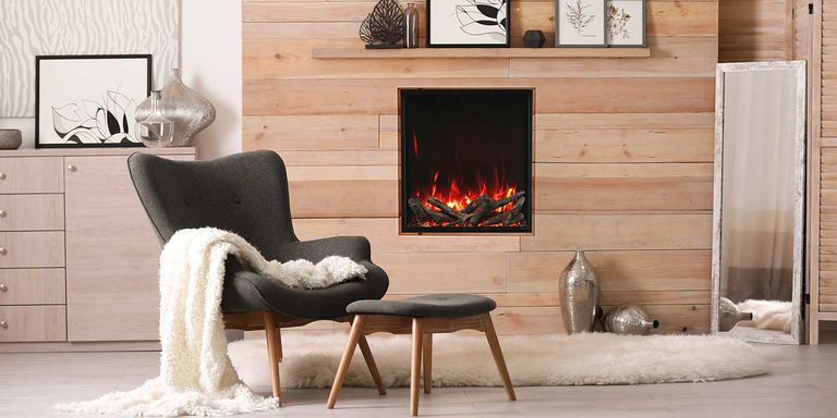 A square-shaped electric fireplace installed in a bedroom space