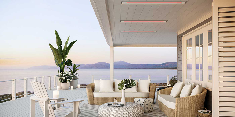 Bromic Platinum Marine Grade patio heaters recessed into the ceiling of an outdoor seating area near the ocean