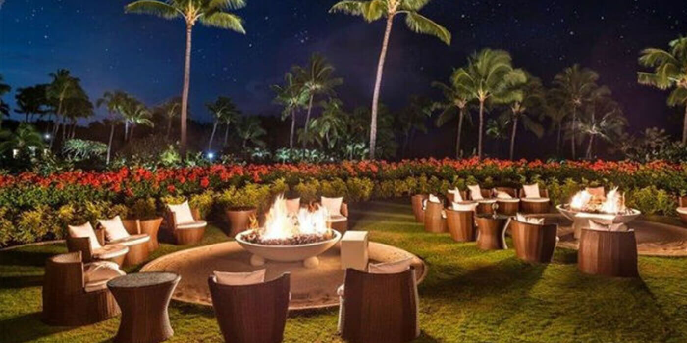 Night view of gas fire bowls at a Hawaiian resort