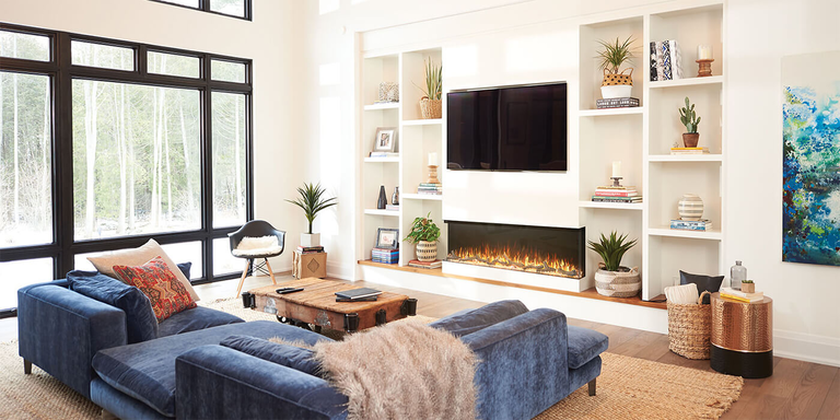 A contemporary living space with a custom-built electric fireplace integrated into a feature wall with shelving and a TV