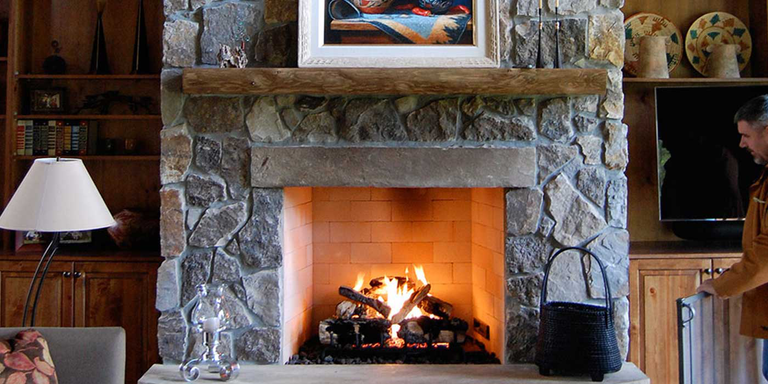 A traditional, natural stone hearth with an BVetto Isokern wood burning fireplace