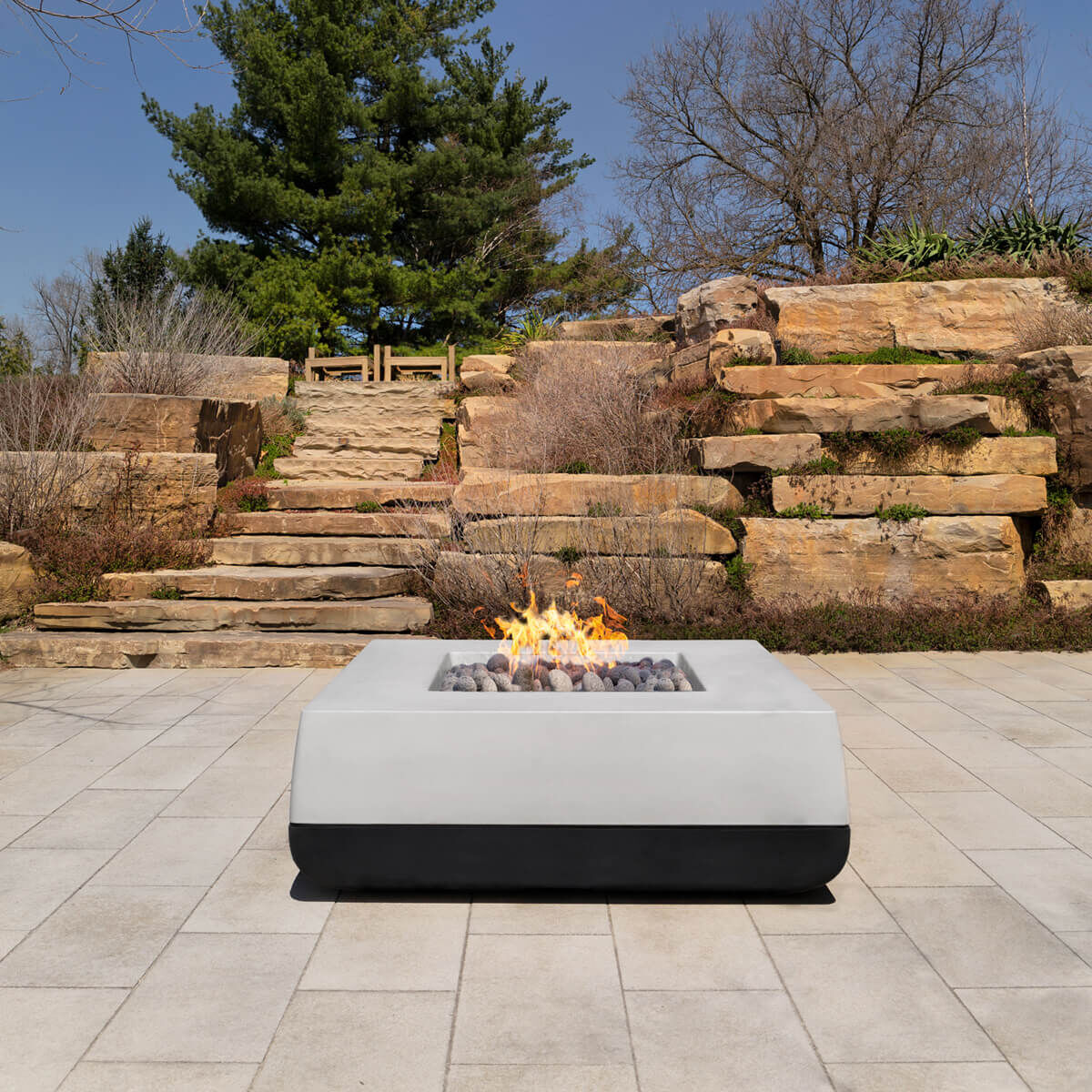 A Quadro outdoor gas fire pit from Flamecraft in carbon and graphite color scheme