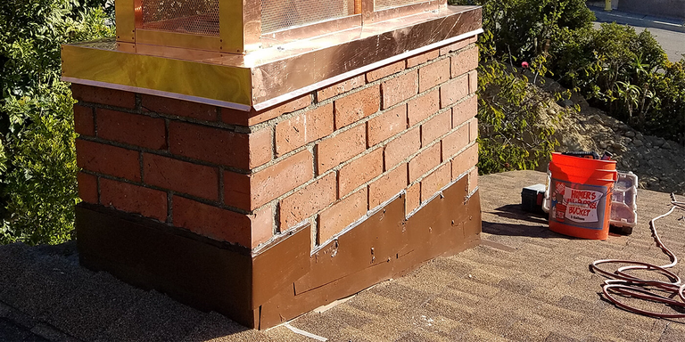 picture of a masonry chimney, a copper chimney cap, step flashing, and a roof, along with some chimney maintenance products