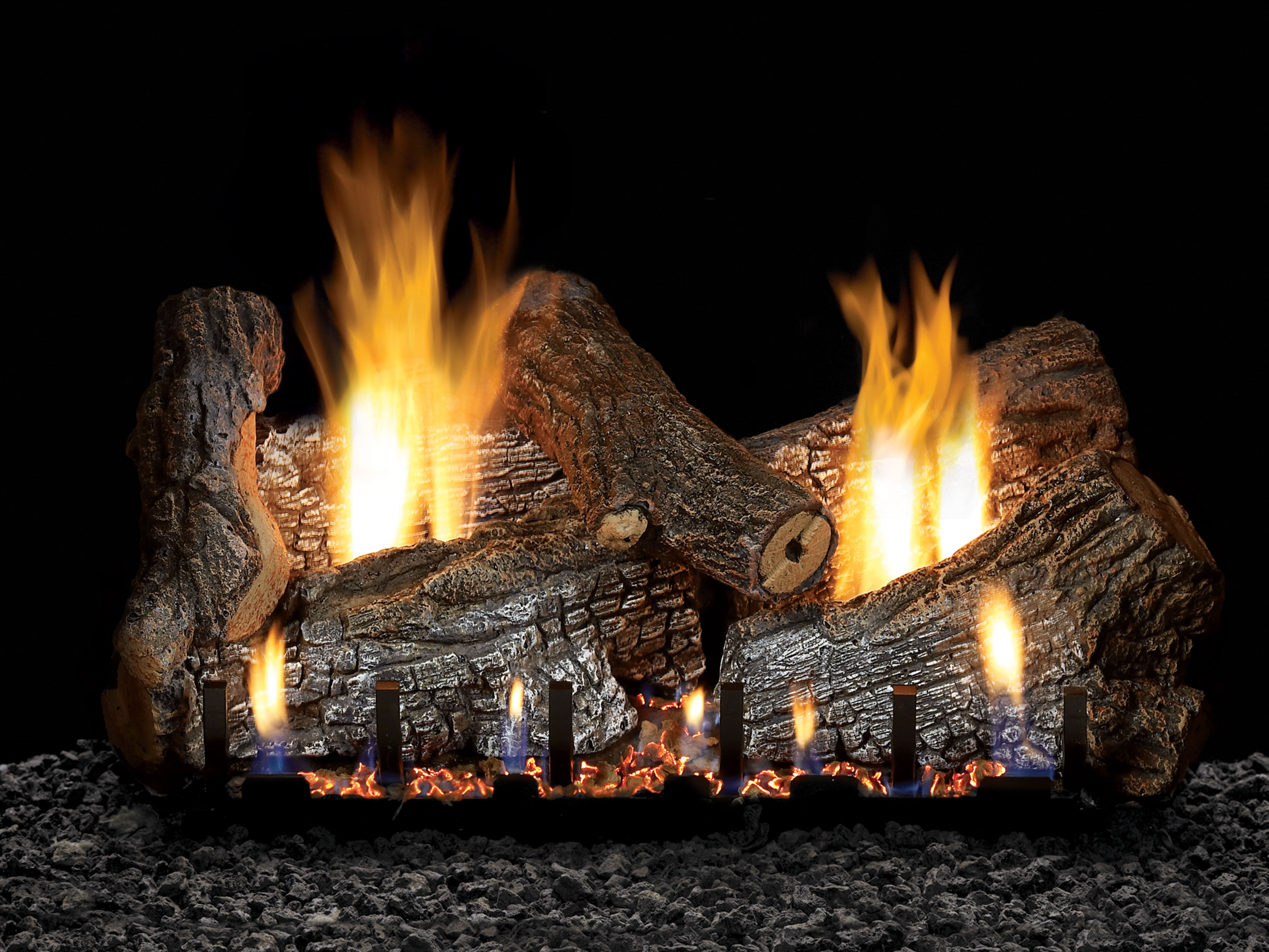 The Sassafras gas log set by Empire mimics the look of a real wood burning fire with its rustic finish, glowing ember bed, and organic flame pattern.
