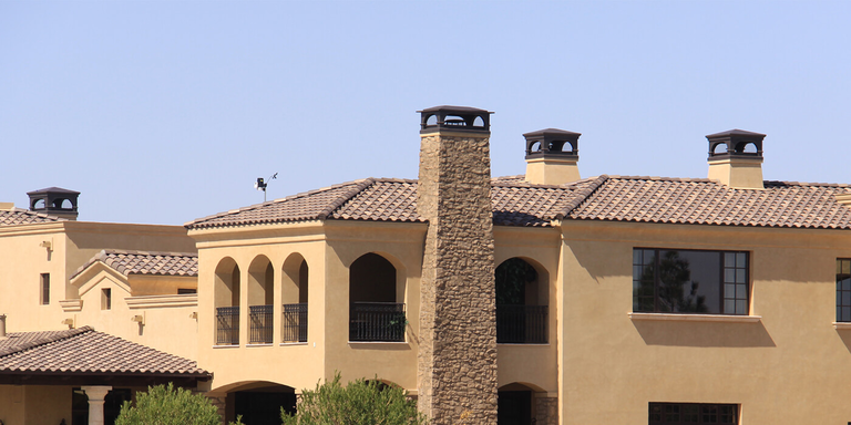 A large copper chimney shroud