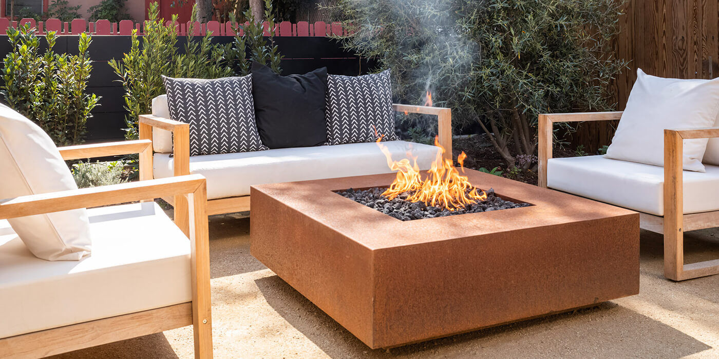 A large, square-shaped Corten Steel gas fire pit  A large, square-shaped Corten Steel gas fire pit