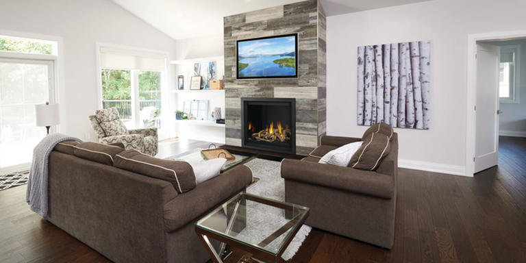 An indoor living space with a traditional, square shaped Direct Vent gas fireplace and log set 