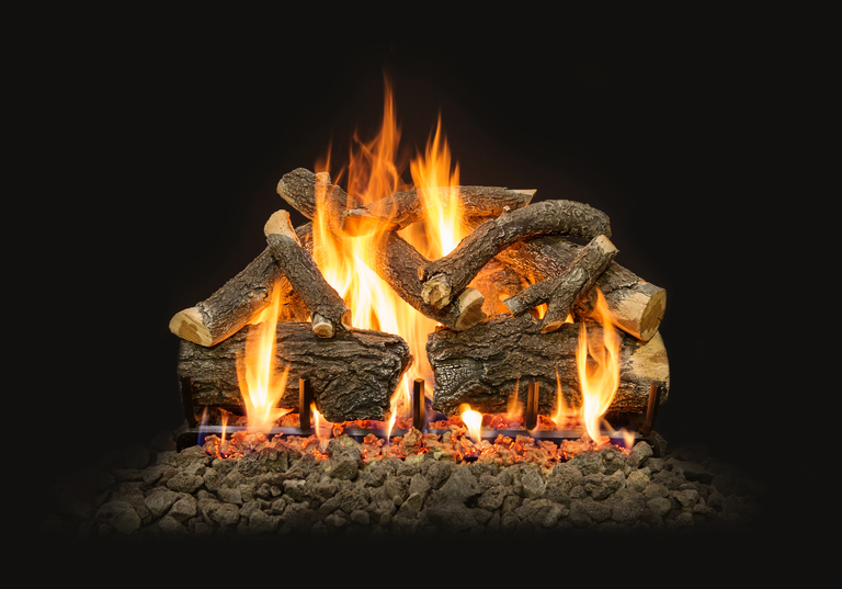 A close-up view of a rustic gas log set with a heavily textured, natural bark finish, a glowing ember bed, and robust flames.