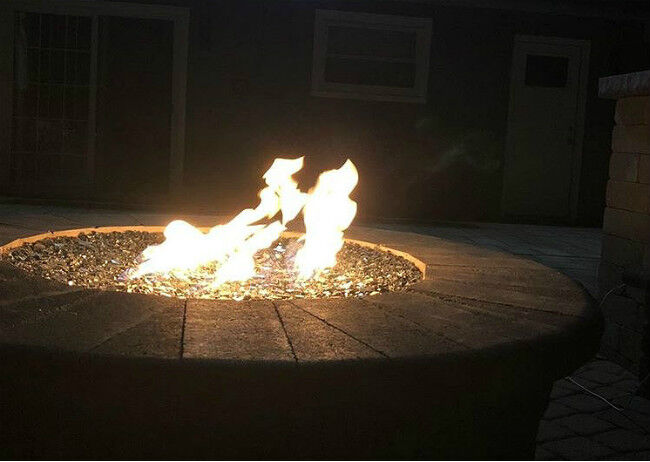 Close-up of flames in a fire pit at nighttime