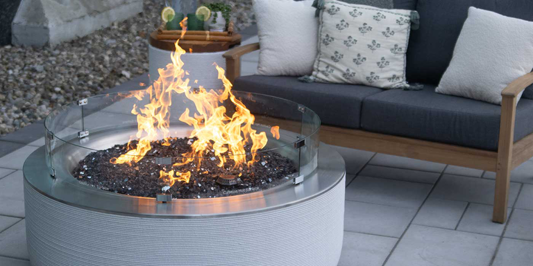 The ReForm Stack Gas Fire Pit by FlameCraft with a Penta-shaped burner