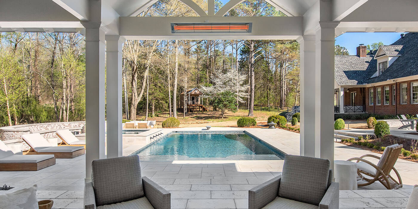 A partially enclosed patio space with a mounted patio heater