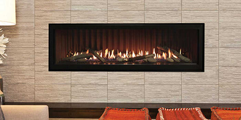 A contemporary, linear Direct Vent Gas fireplace with realistic Driftwood gas logs