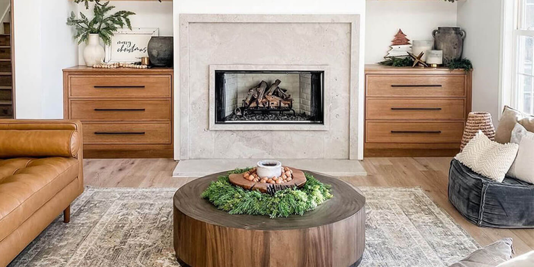 A modern farmhouse styled living space with a linear gas fireplace