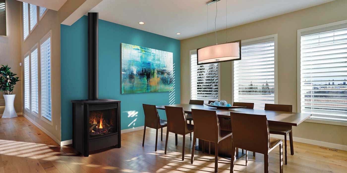 A contemporary dining space with a traditional wood burning stove