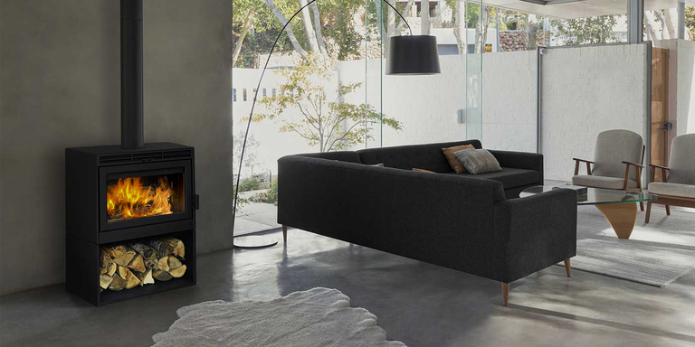 A Supreme Astra wood burning stove installed inside a modern indoor living room