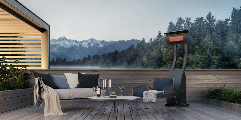 An outdoor sitting space with a freestanding Bromic Tungsten patio heater