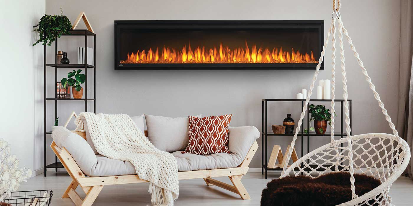 An extra-large, linear electric fireplace with bright orange flames installed in a bohemian-style living space