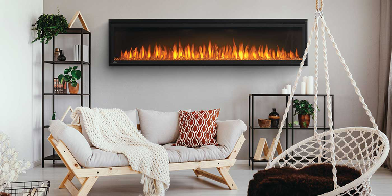 An extra-large, linear electric fireplace with bright orange flames installed in a bohemian-style living space
