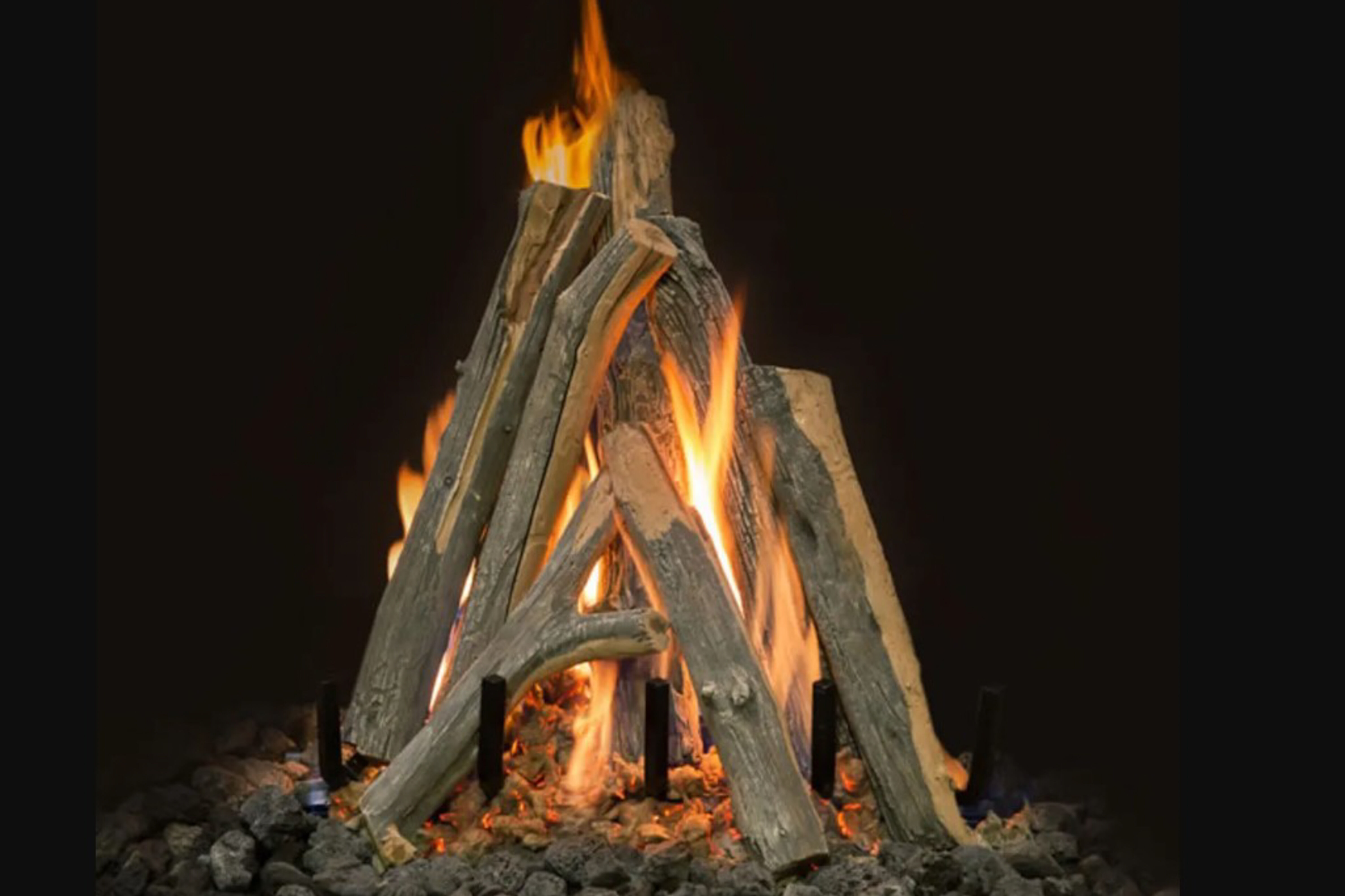 Vented Juniper-style gas logs stacked in a tee-pee style position on a black background.