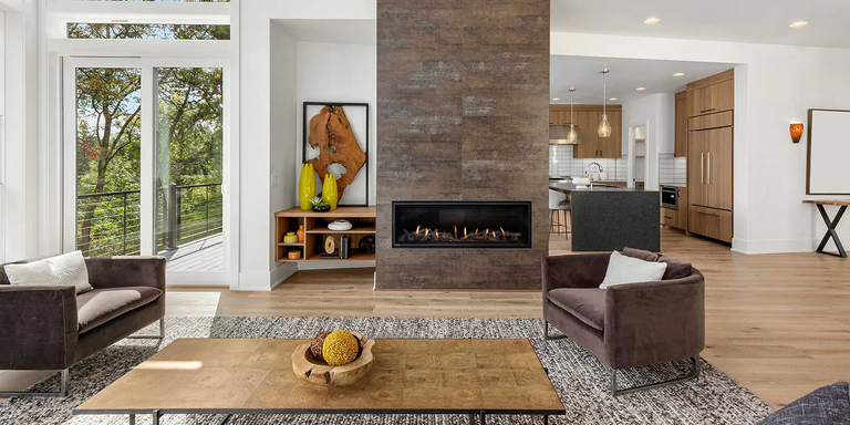 A modern-meets-rustic living room with a contemporary linear gas fireplace 