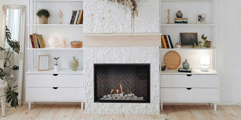 A modern living space with a square Delray gas fireplace by Montigo and a custom mantel