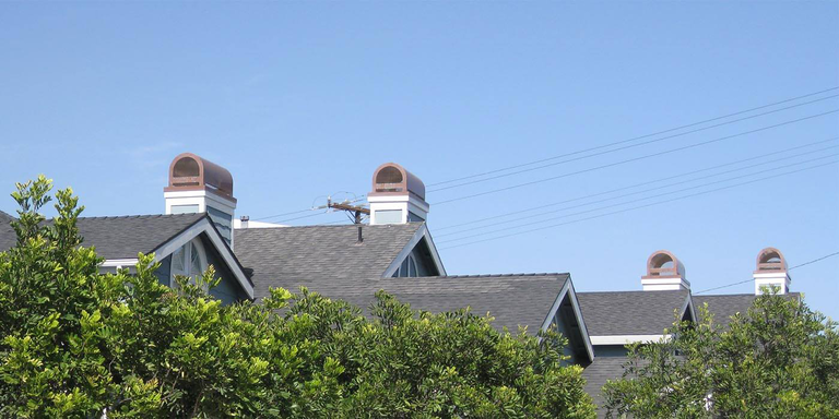 Four custom chimney shrouds from the brand American Chimney Shroud