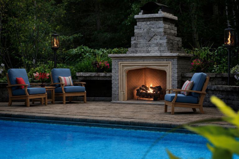 Outdoor fireplace with flame blowing in the wind.