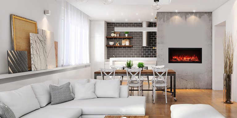 Bright modern open-concept living and dining room with white sectional seating, a wood dining table, dark subway tile kitchen backsplash, and a sleek linear fireplace set into a concrete accent wall.